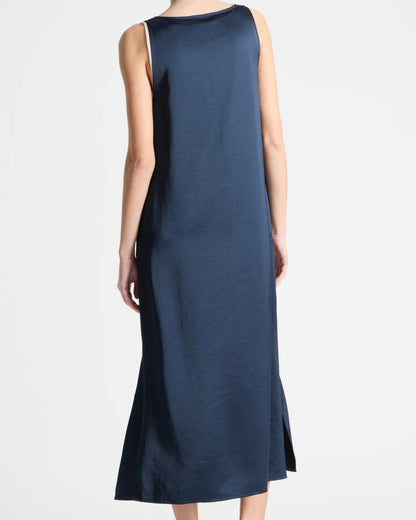 Navy sleeveless dress worn by a person on a white background