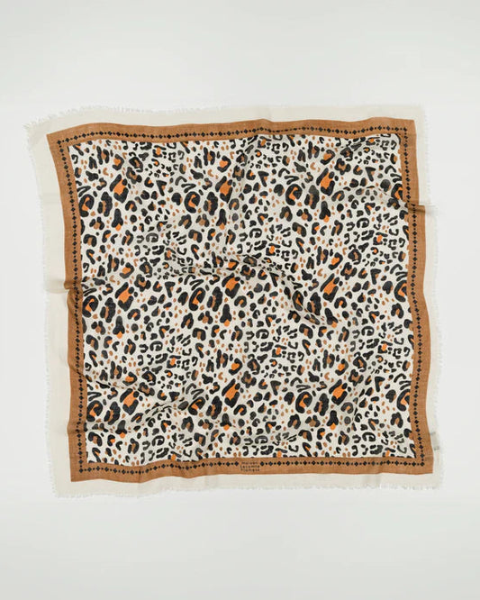 The Leo Scarf Beige by Maison Lecomte Flament is a square leopard wool scarf in black, beige, and brown with a brown border and dot details, shown laid flat on a white background.