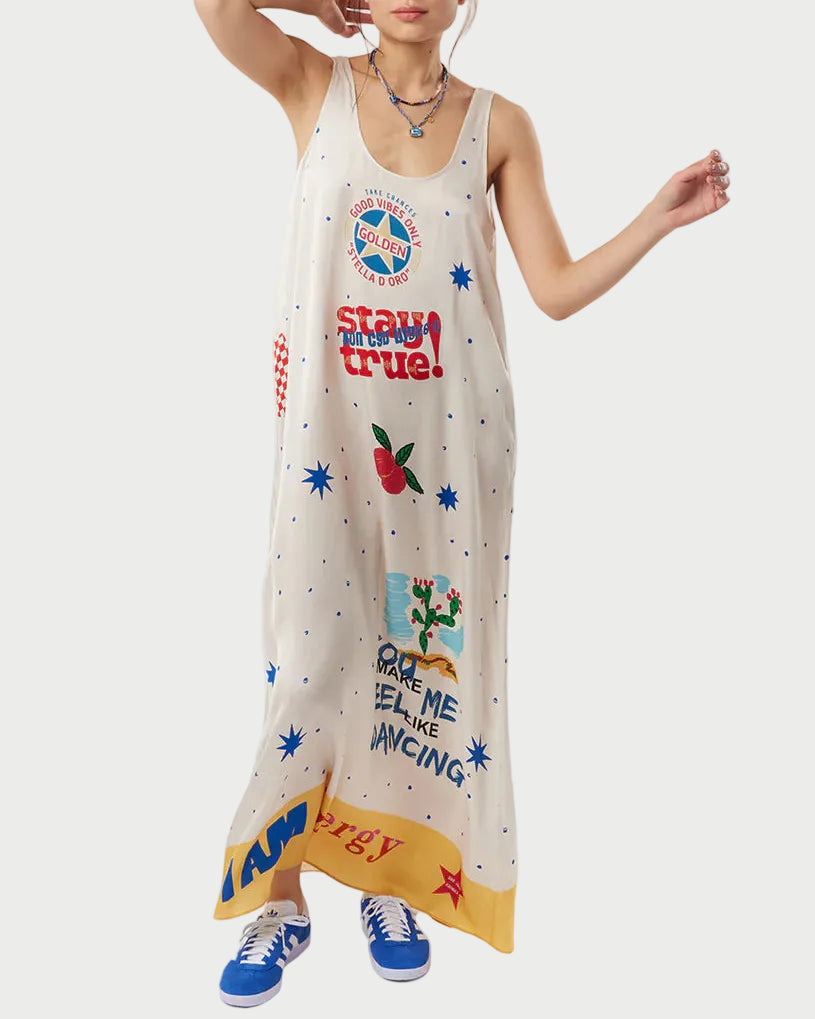 Woman wearing a sleeveless dress with colorful graphics and text on a white background