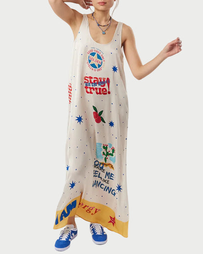 Woman wearing a sleeveless dress with colorful graphics and text on a white background