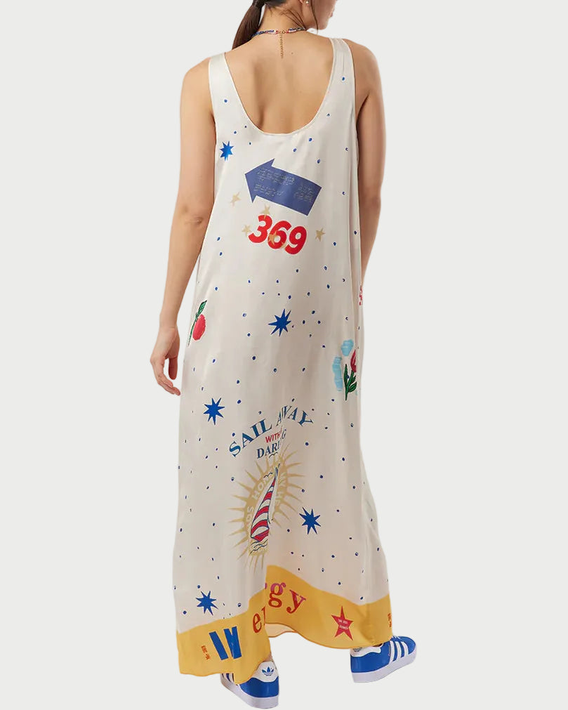 Woman wearing a sleeveless dress with colorful graphics on a white background