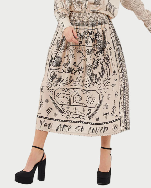 Woman wearing a patterned outfit with text on a white background