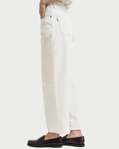 White pants worn by a person on a white background