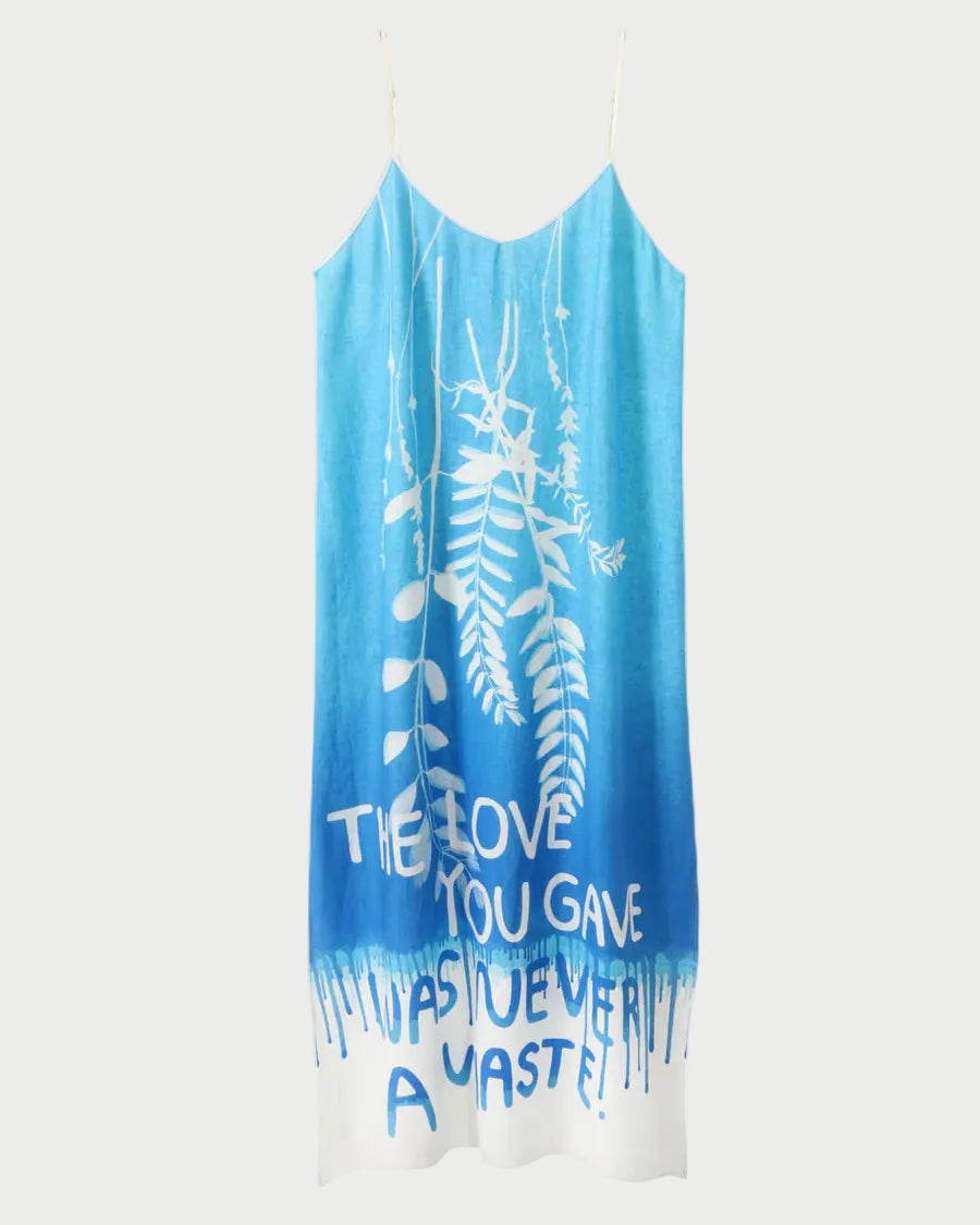 Blue and white dress with floral design and text on a white background
