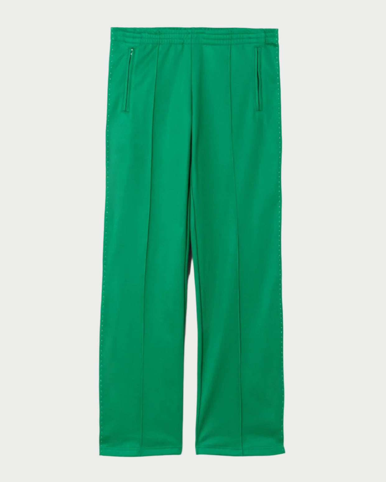 The RE/DONE Sunland Track Pant is a sporty, bright green straight-leg style with front vertical seams and two zippered hip pockets, shown laid flat on a plain white background.