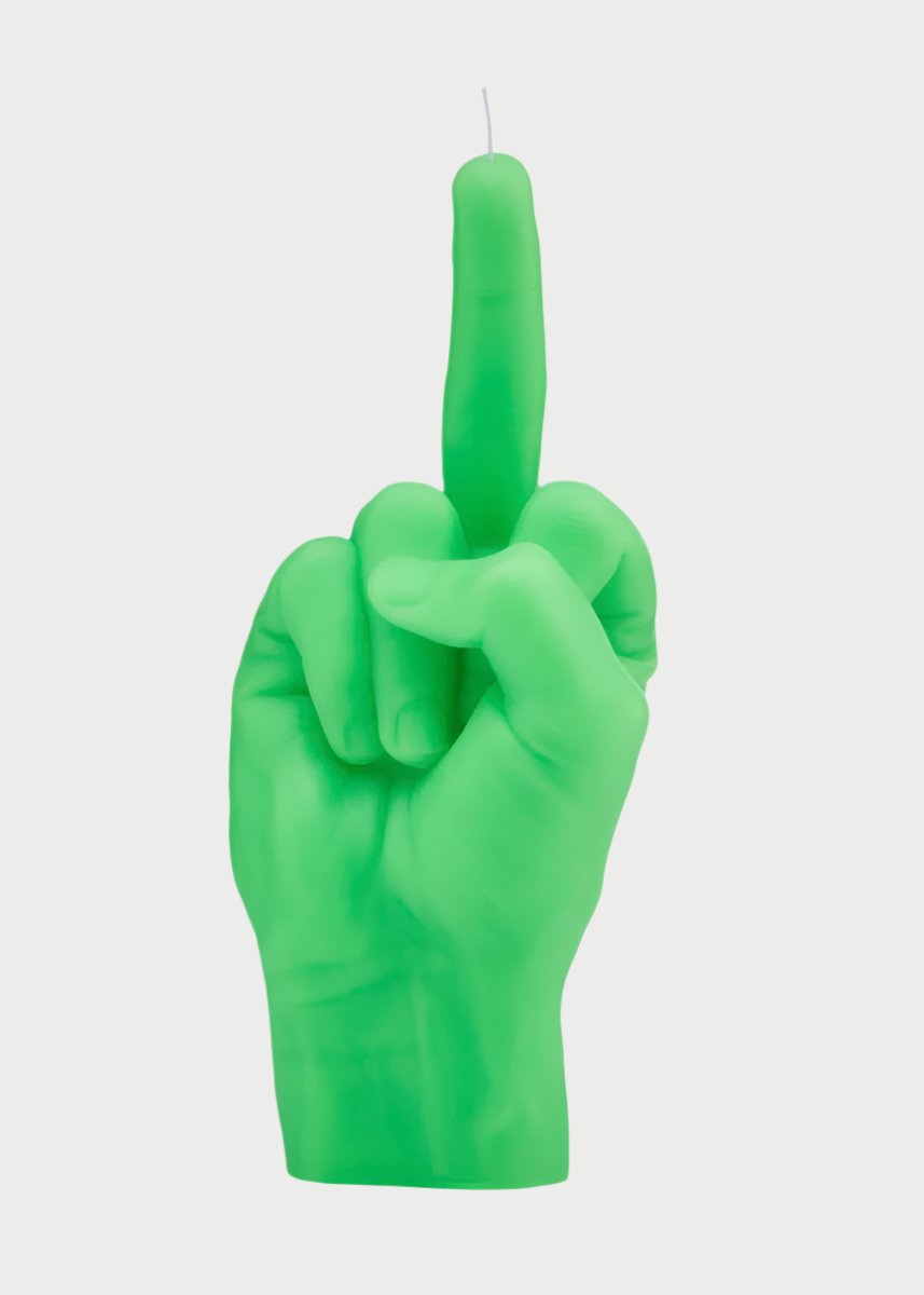 A green F*ck You Candle Hand by 54° Celsius, shaped like a human hand making an obscene gesture with the middle finger extended upwards, perfect for setting a defiant mood. The wick is positioned at the tip of the middle finger, against a plain white background.
