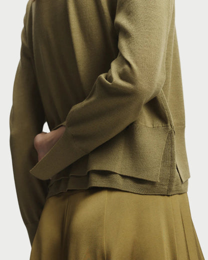 Green outfit with a jacket and skirt on a white background