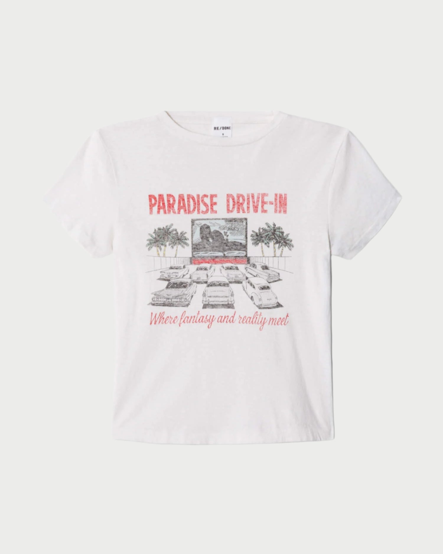 The RE/DONE Drive In Tee features a vintage-inspired graphic with cars, palm trees, and "PARADISE DRIVE-IN" text. This cropped tee channels retro vibes, blending nostalgia with modern style.