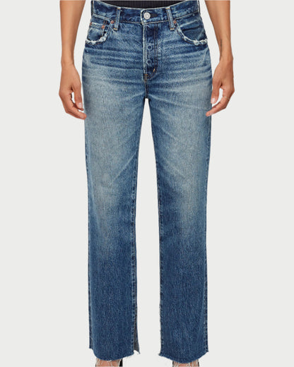 Person wearing blue jeans on a white background