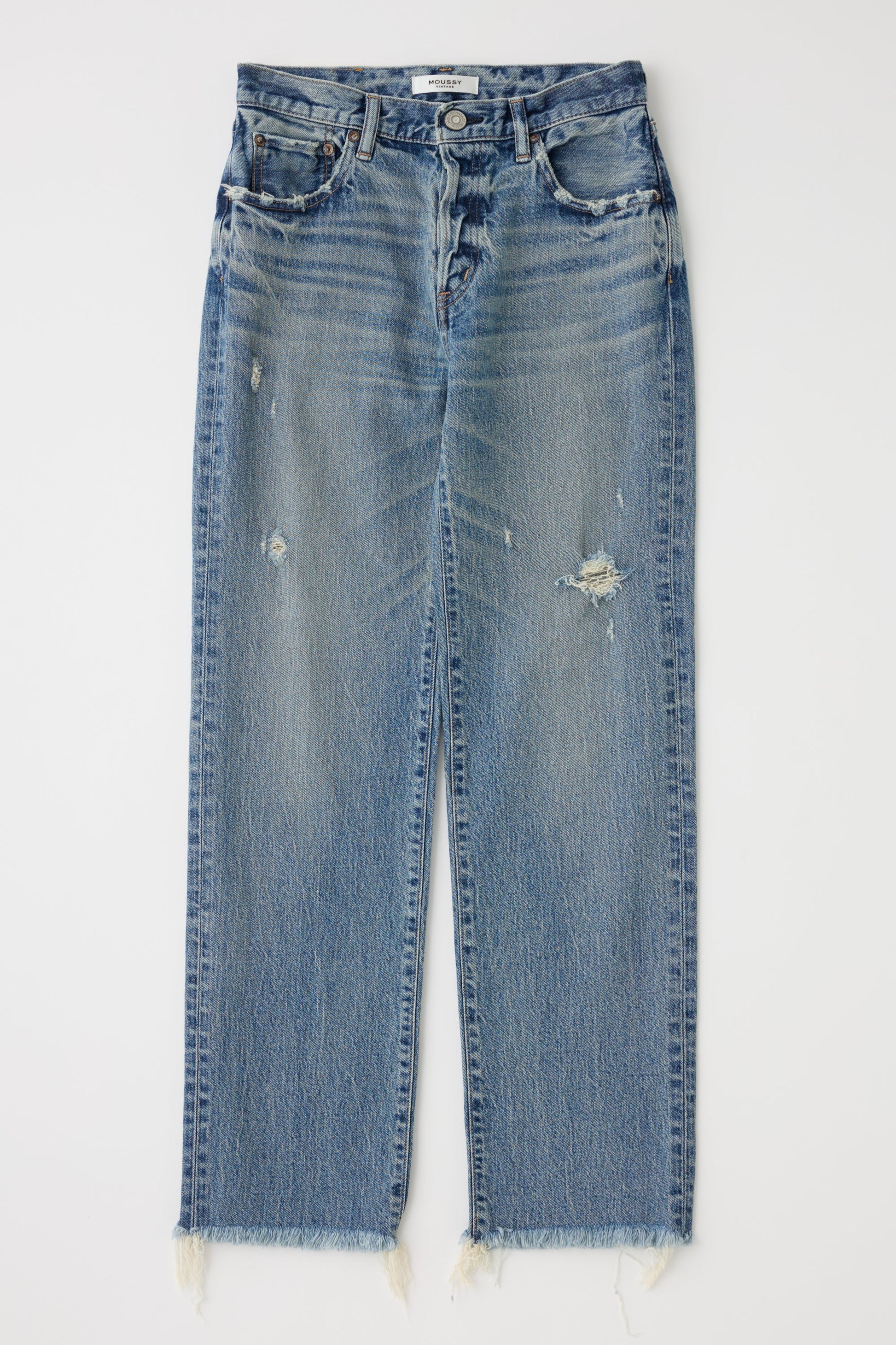 Blue jeans with a slight distressed look on a white background