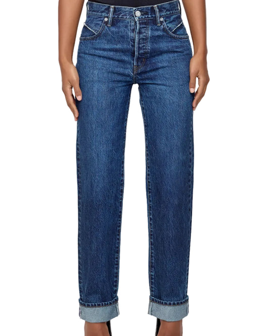 Person wearing blue jeans on a white background