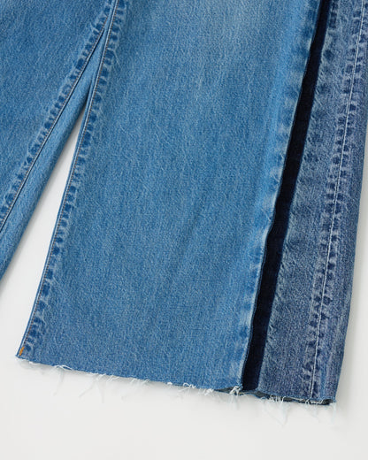 Close-up of blue denim fabric on a white background
