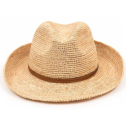 The Travaux en Cours Raffia Fedora Hat features light brown raffia, a wide brim, and a slim brown band—an essential summer accessory, shown against a white background.