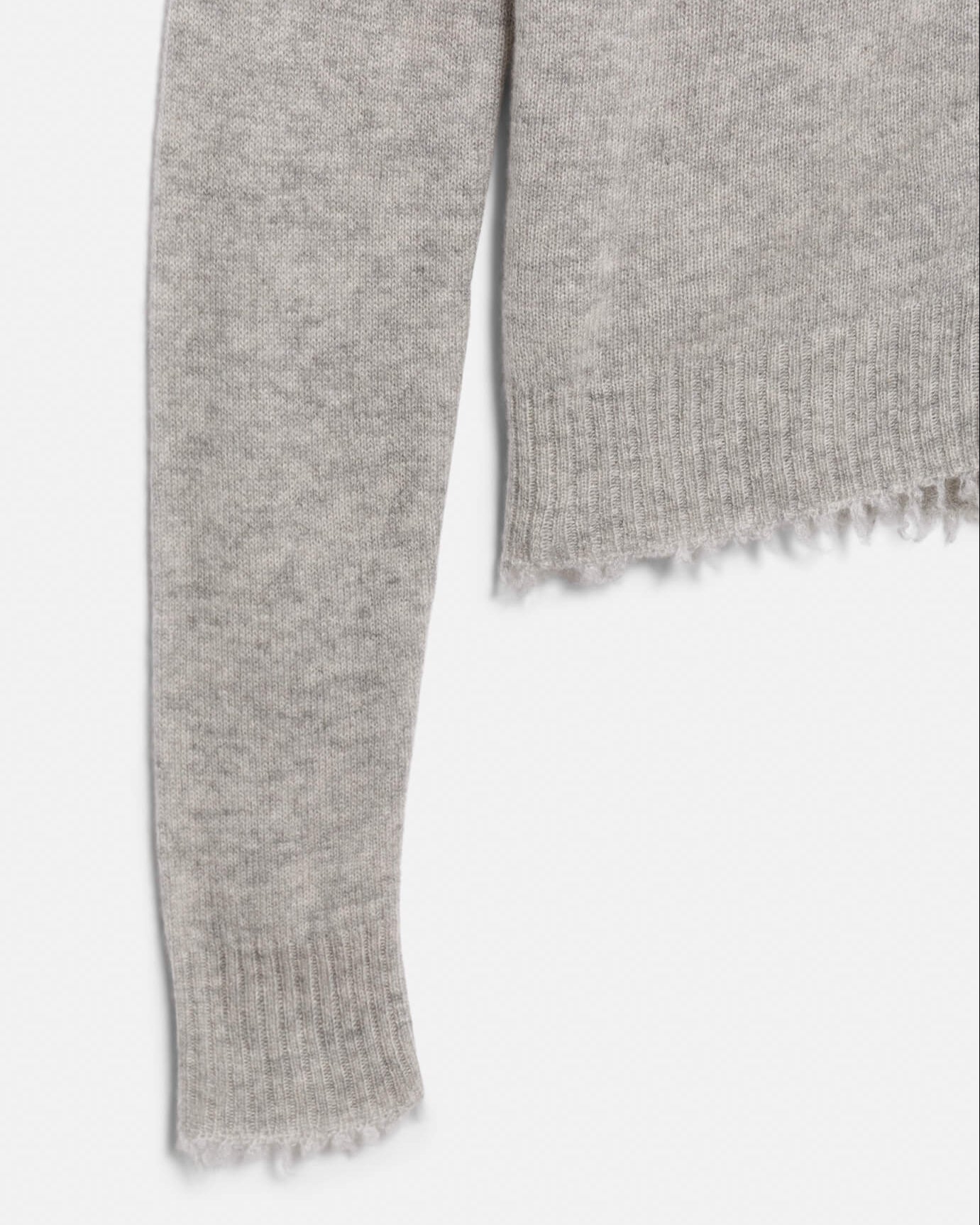 Gray knitted scarf with frayed edge on a white background