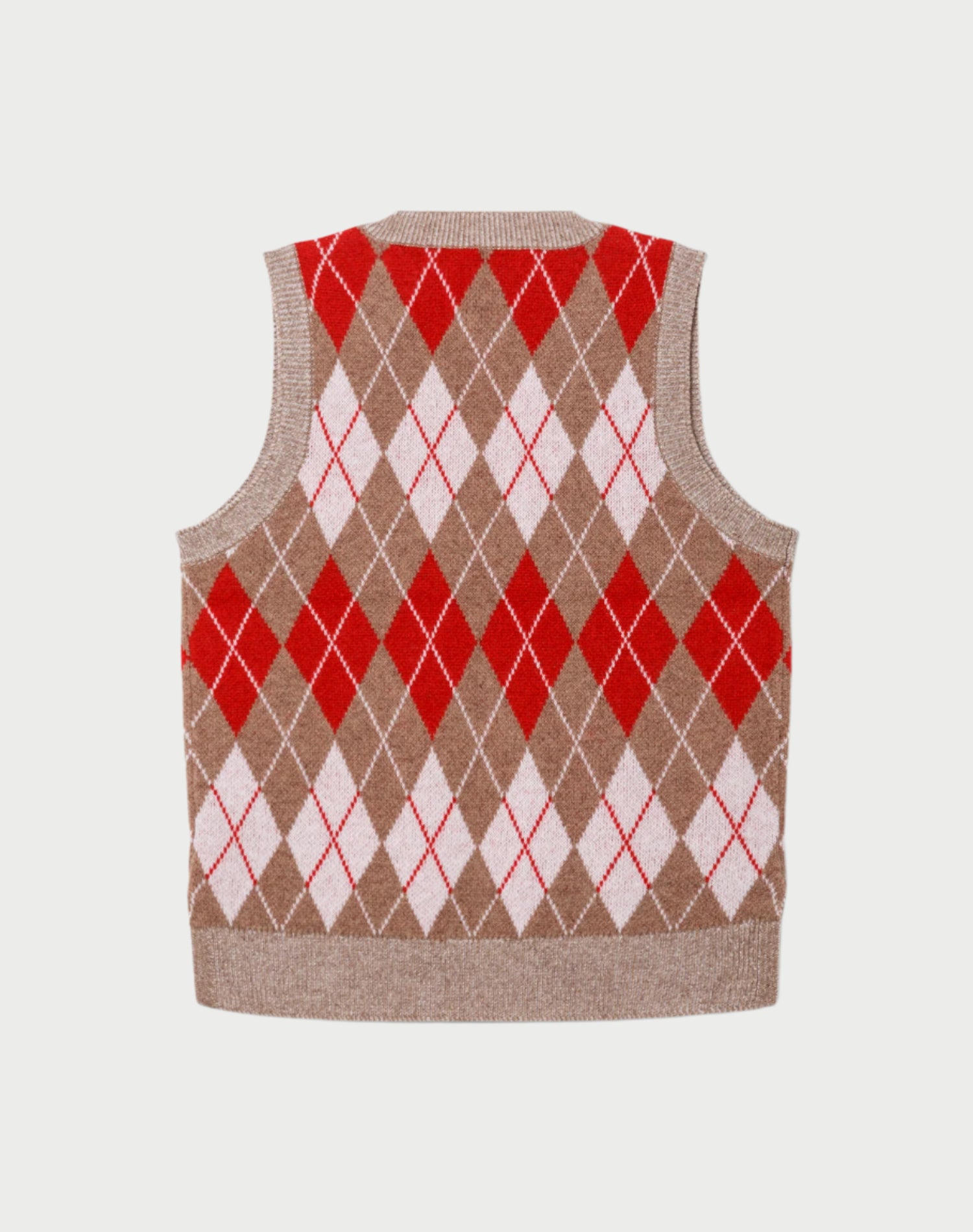 Argyle patterned sweater vest with red and white diamonds on a beige background