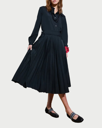 Woman wearing a black dress with a white background