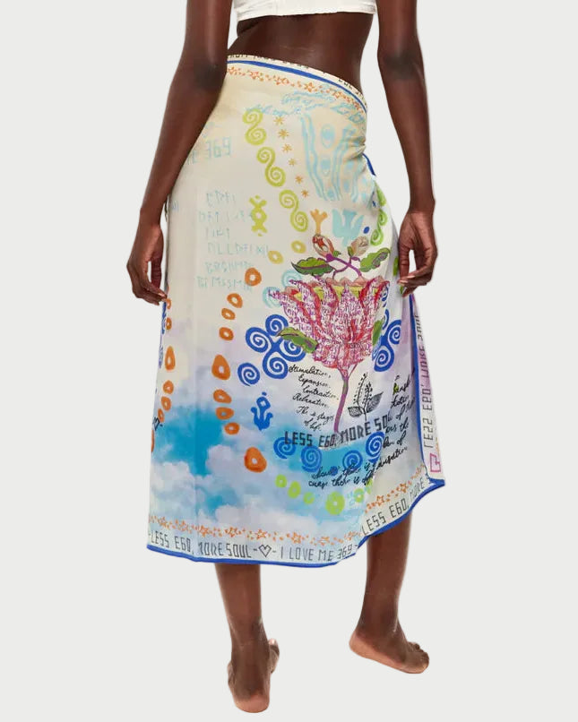 Woman wearing a colorful sarong with a white background