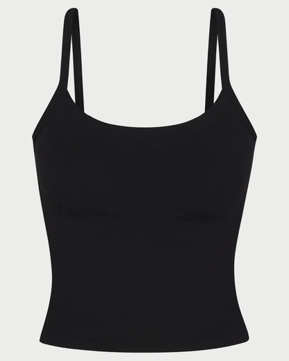 Black tank top with thin straps on a light gray background