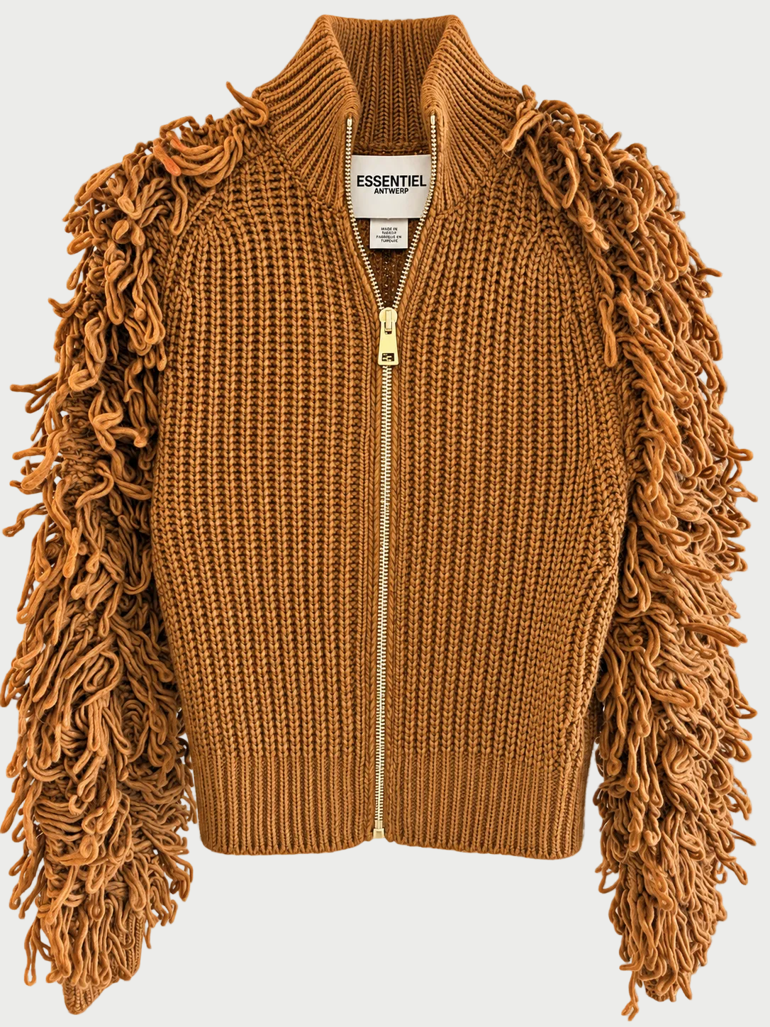 A camel brown ribbed knit zip-up jacket featuring long, shaggy fringe sleeves and a gold-tone zipper, shown against a gray checkerboard background.