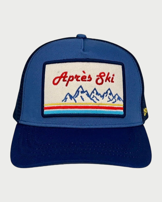 Blue cap with 'Apres Ski' patch on a white background