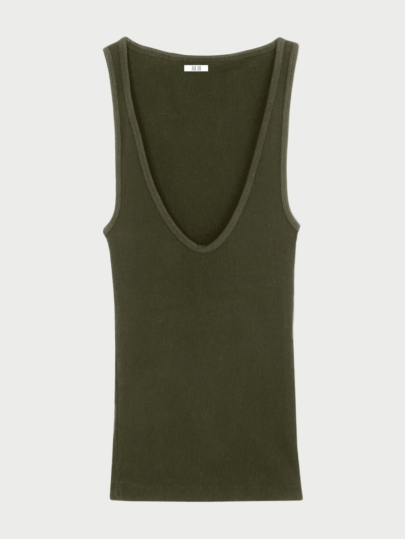 Green tank top on a beige background