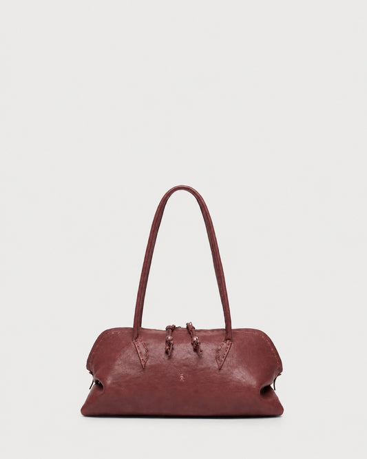 A slouchy, rounded maroon Henry Beguelin Bolla Bassa Bag with a top handle, showcasing fine Italian craftsmanship.