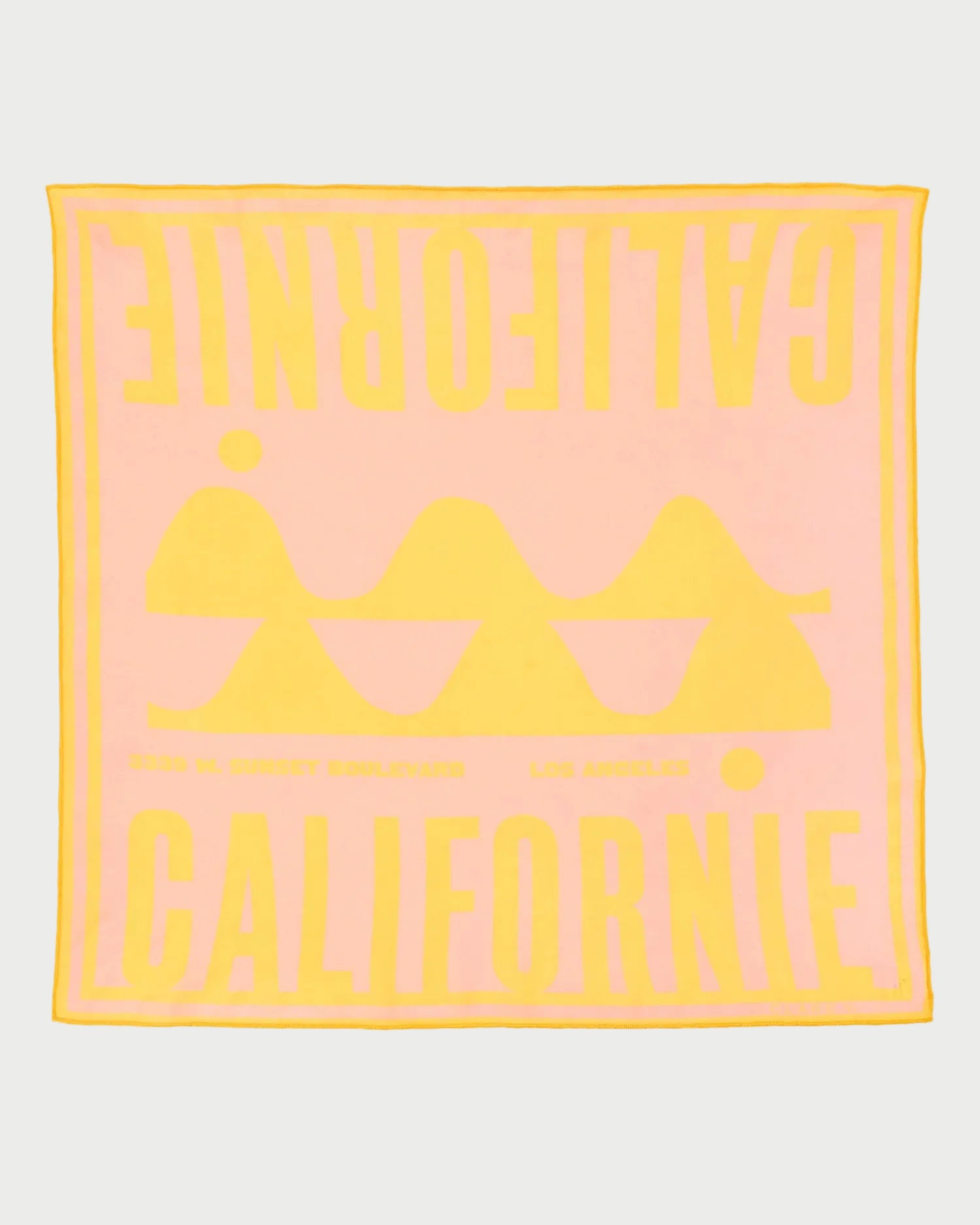 Pink towel with yellow text and logo on a white background