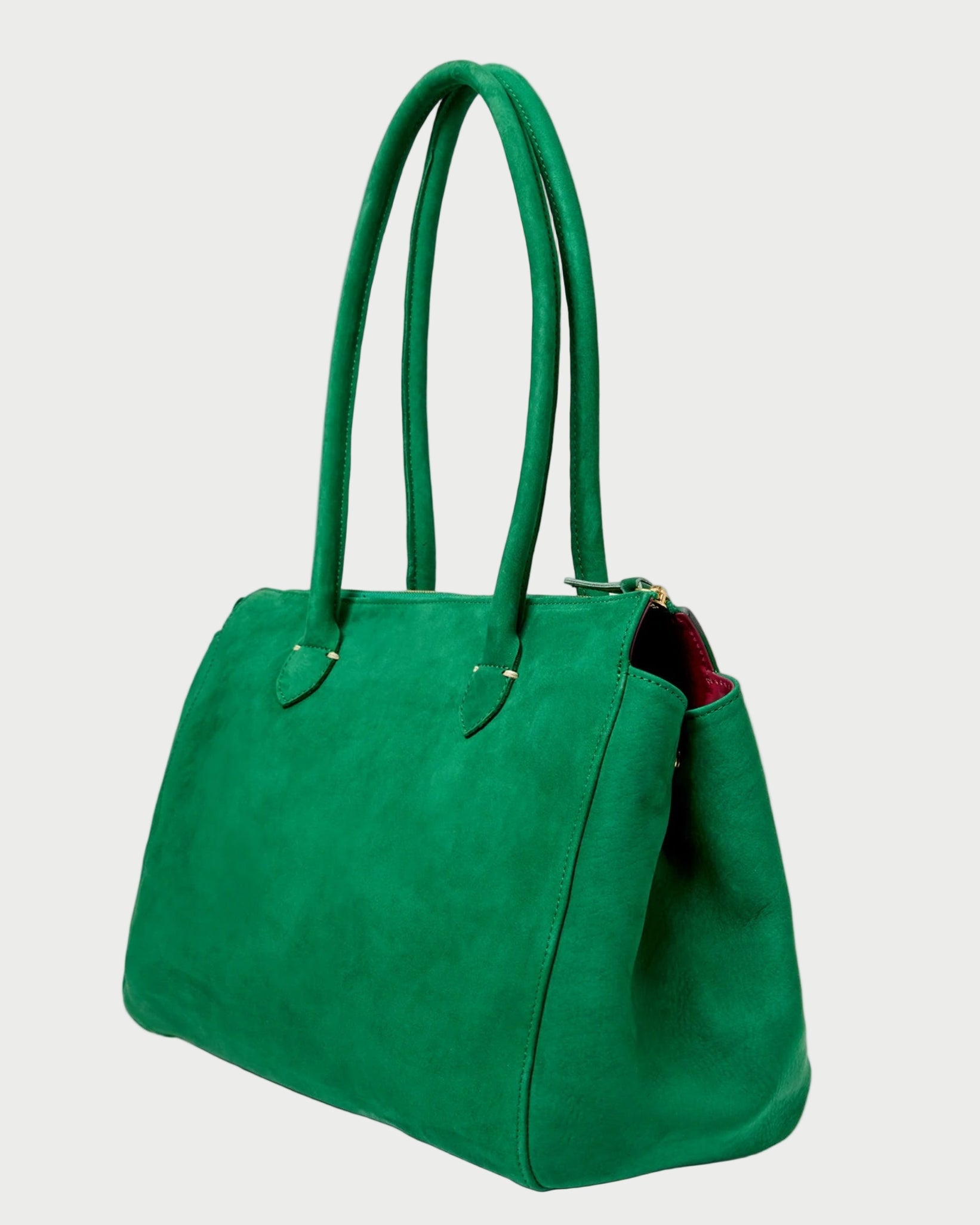 Green handbag on a light gray background