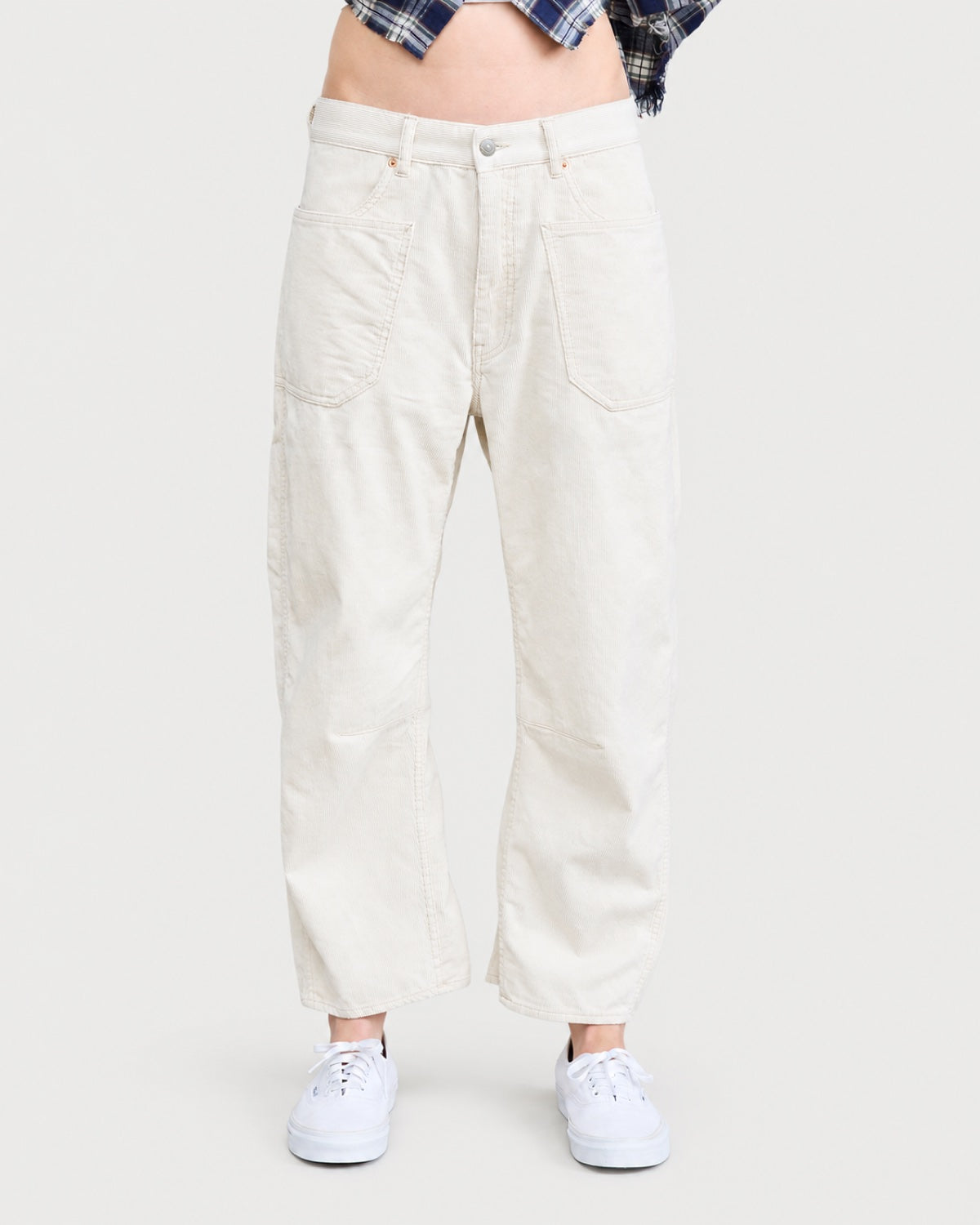 Off-white DENIMIST Bella Utility Pant in a barrel-leg silhouette with patch pockets and reinforced knees, worn with white sneakers.