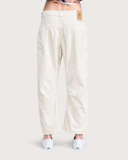 Back view of the off-white DENIMIST Bella Utility Pant featuring a high-waisted barrel-leg silhouette in corduroy with back patch pockets.