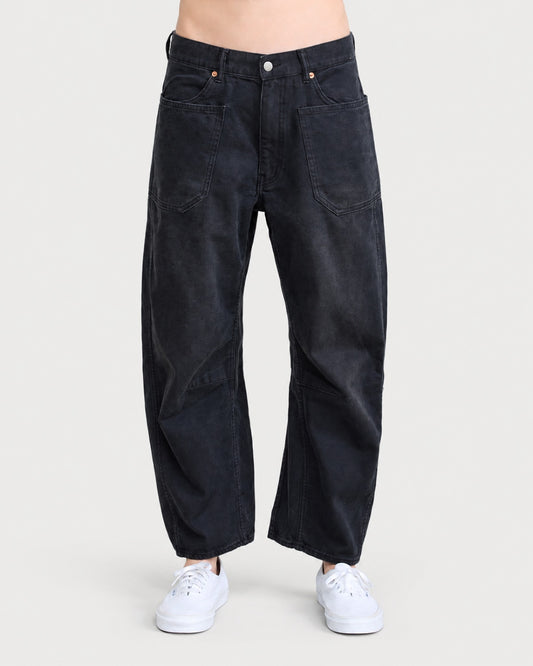DENIMIST Bella Utility Pant in black denim, featuring large front patch pockets and a relaxed, barrel-leg silhouette.