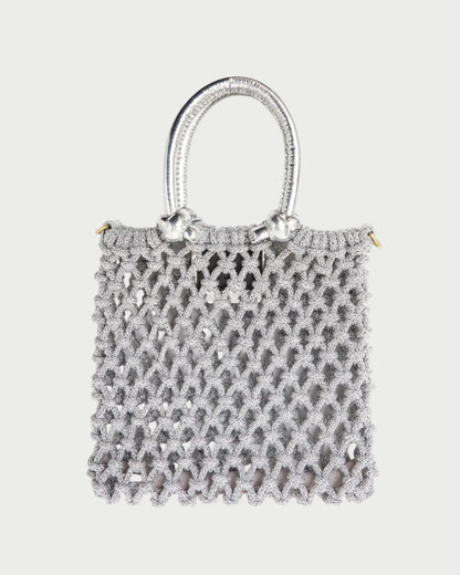 Small textured handbag on a white background