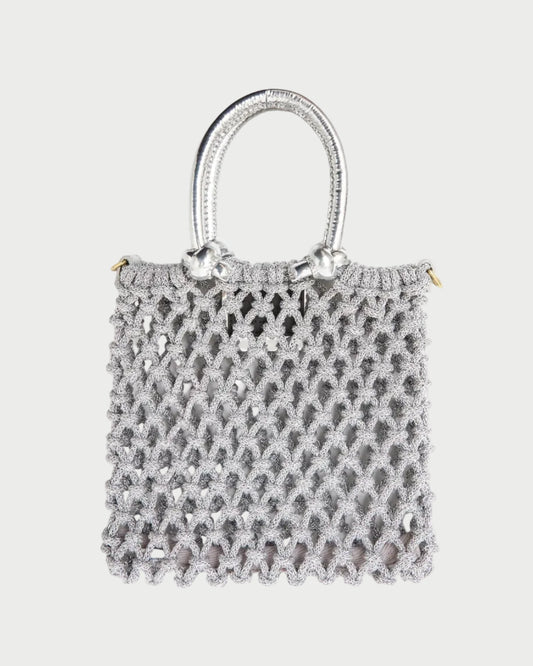 Small textured handbag on a white background