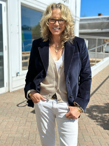 WEST Boutique owner Kitt Shapiro wearing Frame corduroy blazer with One Grey Day sweater, r13 jeans and Dylan James jewelry at west2westport.com