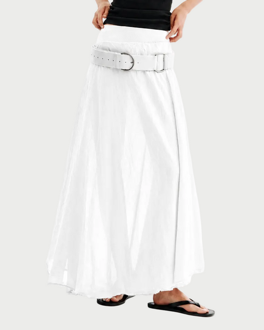 Woman wearing a black tank top and white pants on a white background