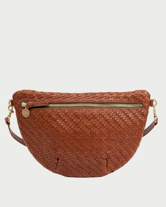Brown woven crossbody bag on a white background