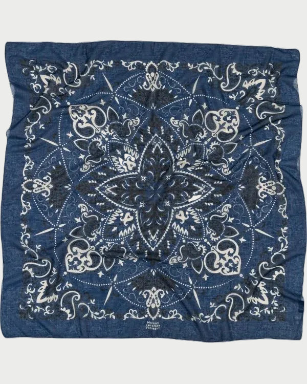 Blue bandana with white patterns on a white background