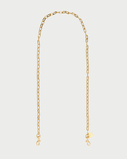 A delicate gold chain necklace with a small round tag and lobster clasp closure, displayed against a clean white background.