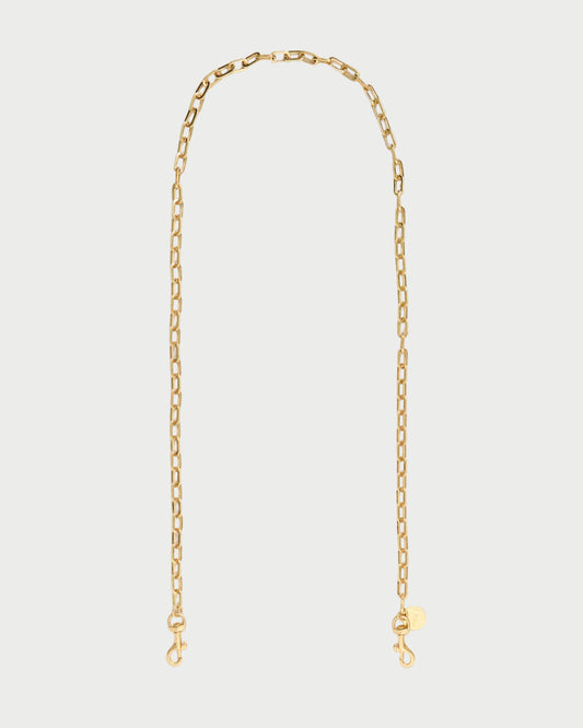 A delicate gold chain necklace with a small round tag and lobster clasp closure, displayed against a clean white background.