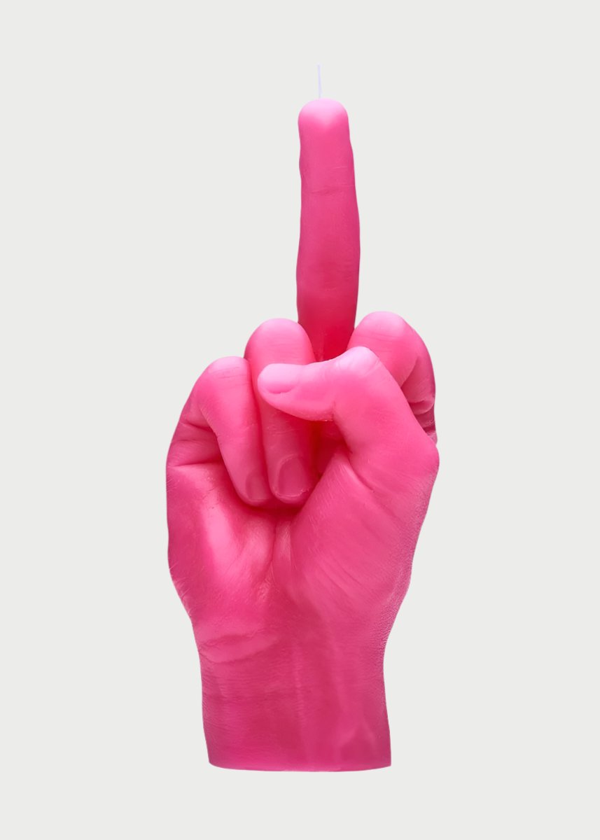 A pink 54° Celsius F*ck You Candle Hand shaped like a human hand making the offensive "f*ck you" gesture with the middle finger raised is displayed against a plain white background, capturing an irreverent mood.