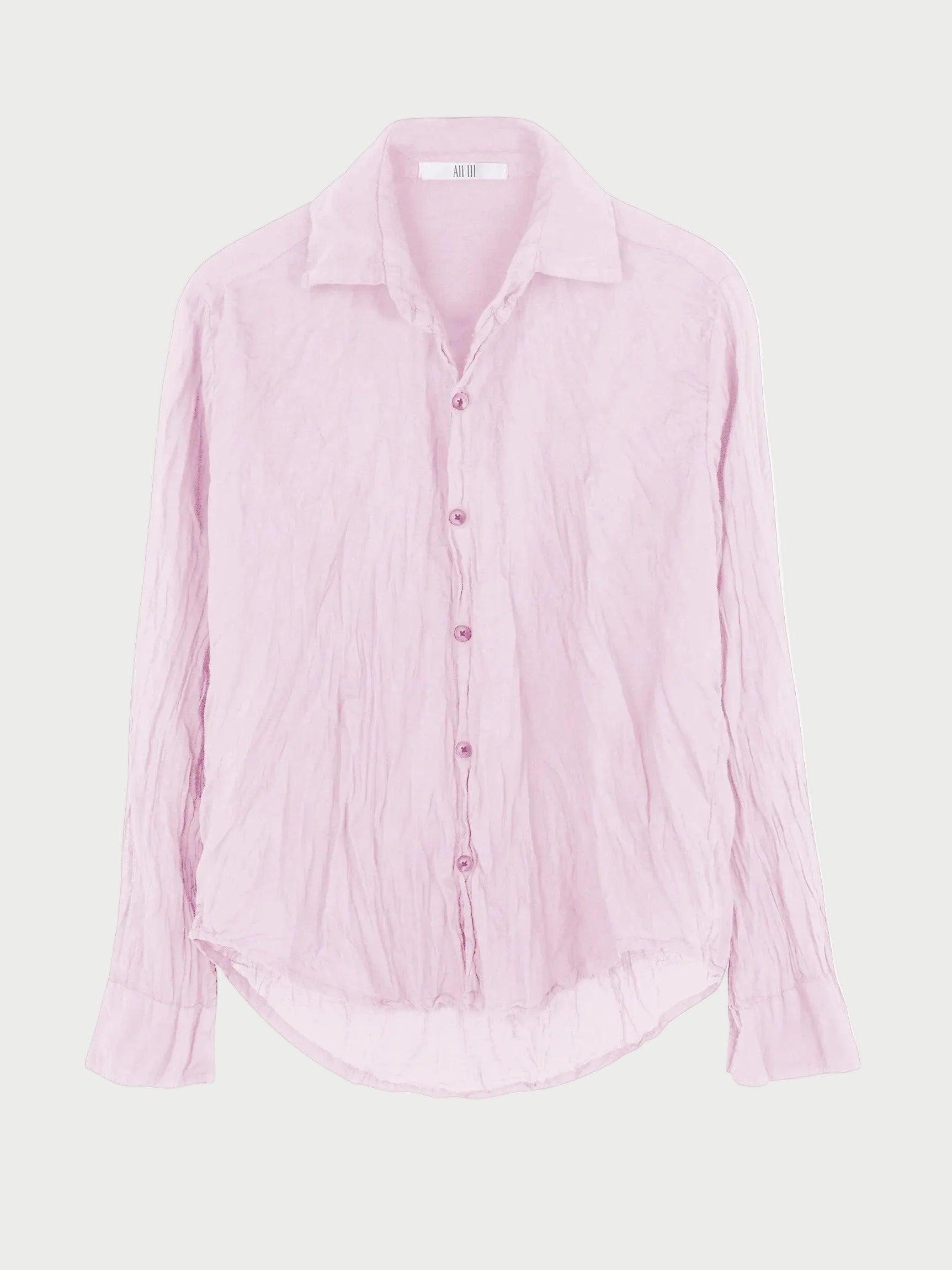 The All III Daniel Button Down by All III is an oversized, light pink cotton gauze shirt featuring long sleeves, a wrinkled texture, pointed collar, and curved hem. Displayed against a plain white background, this button-down offers effortless style and comfort.