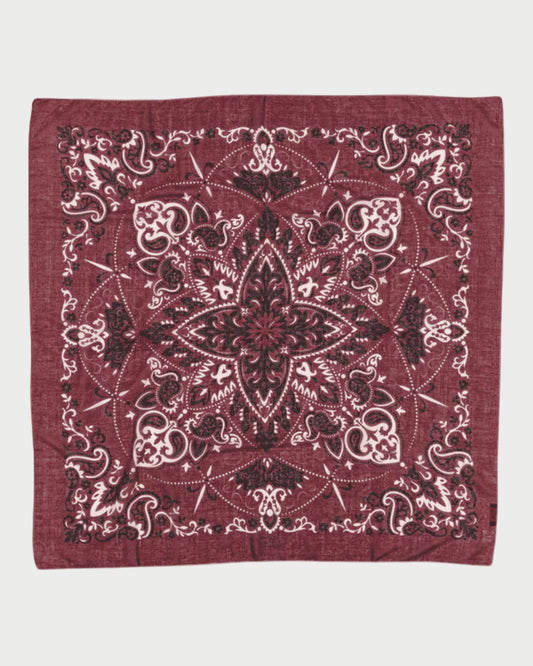 Red bandana with intricate black patterns on a white background