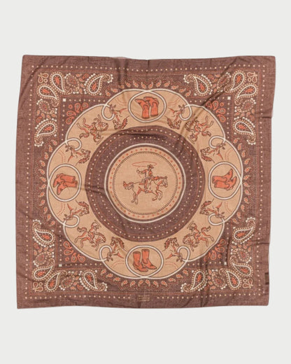 Decorative fabric square with intricate patterns on a white background
