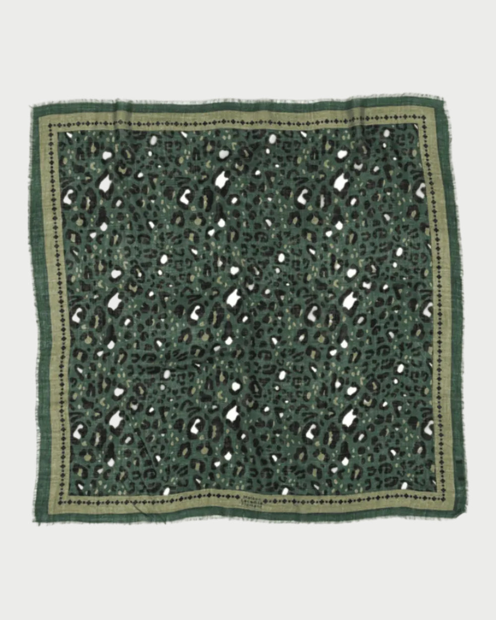 The Leo Scarf Green by Maison Lecomte Flament is a luxury square wool scarf with a green, black, and beige leopard print, frayed edges, and a stylish beige border.