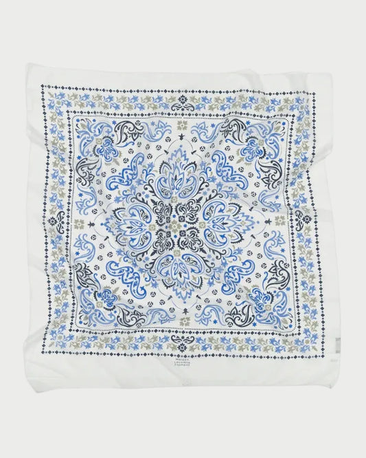 White bandana with blue and black paisley pattern on a white background