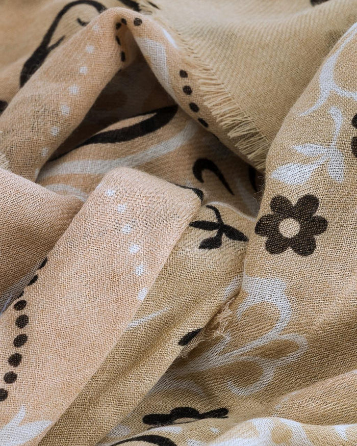 Beige fabric with black floral patterns