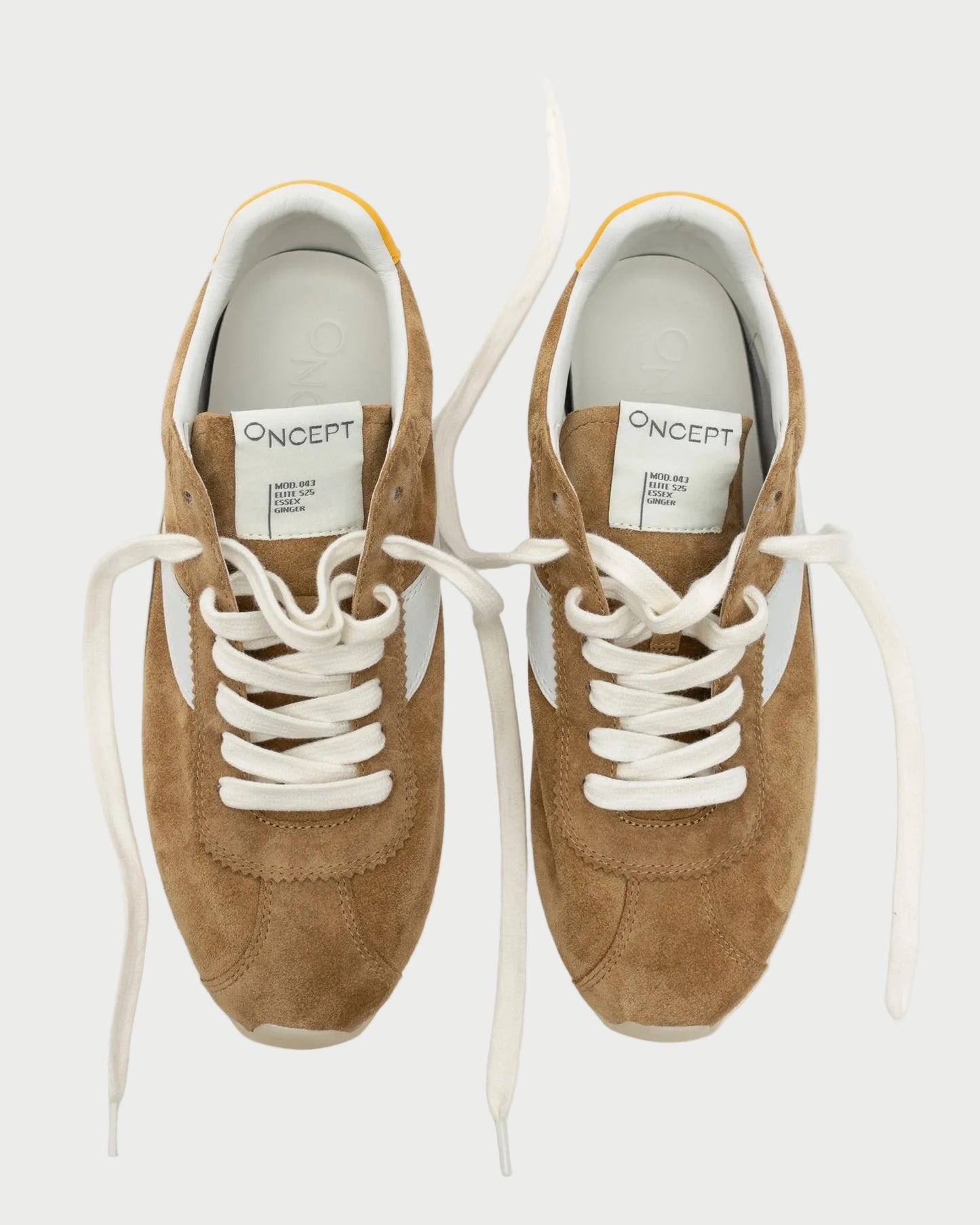 A pair of Oncept Essex Sneakers in Ginger suede, featuring white laces and inner soles, viewed from above on a plain white background. Sustainably crafted with branded tongue labels.