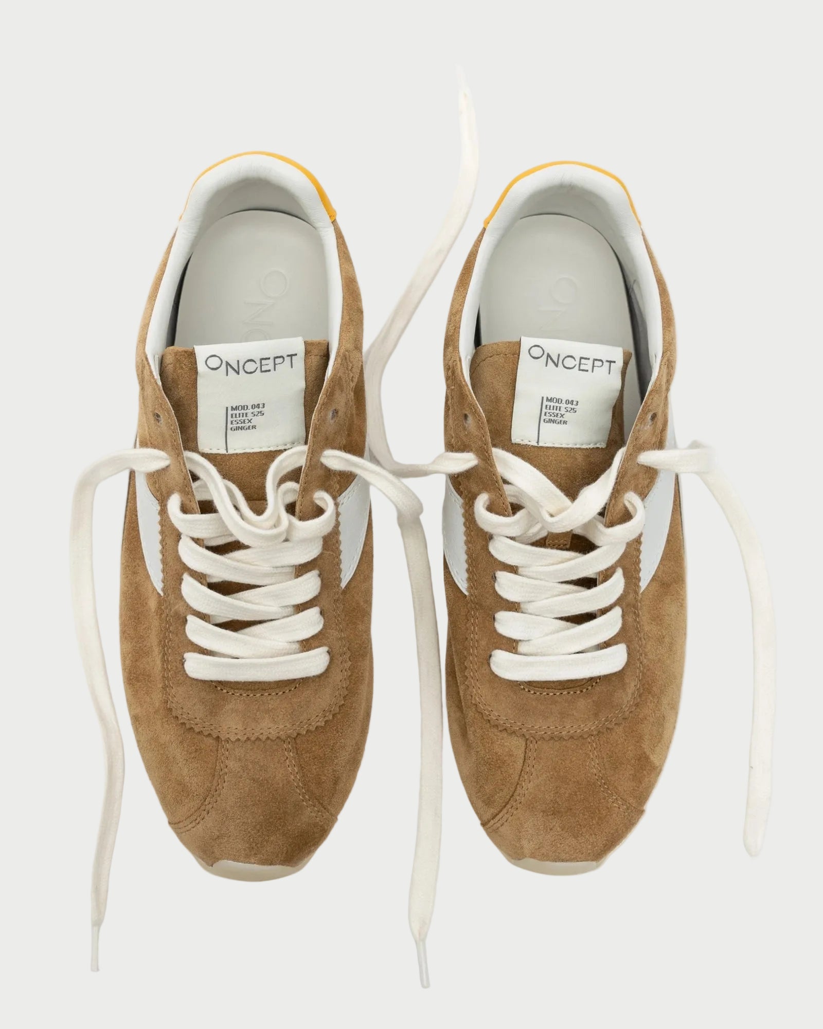 A pair of Oncept Essex Sneakers in Ginger suede, featuring white laces and inner soles, viewed from above on a plain white background. Sustainably crafted with branded tongue labels.