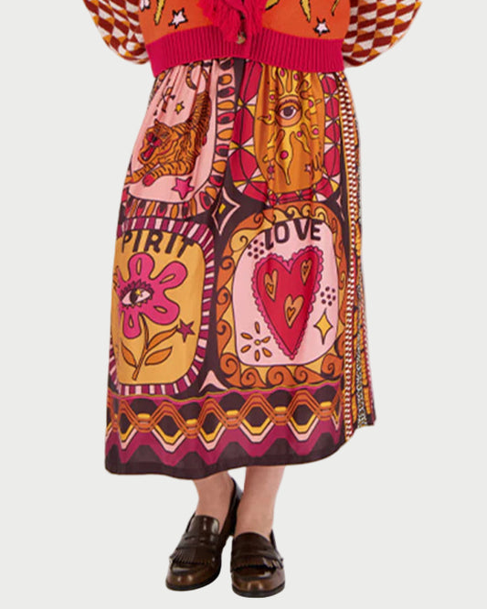 Woman wearing a colorful patterned dress on a white background