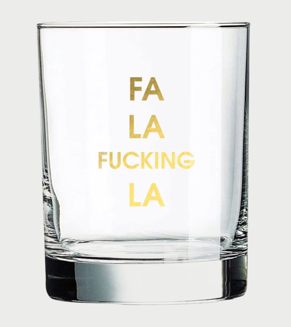 The Chez Gagné More Rocks Glasses by Chez Gagné feature a clear design with gold foil text reading "FA", "LA", "FUCKING", "LA" vertically centered in separate lines on the front of the glass.